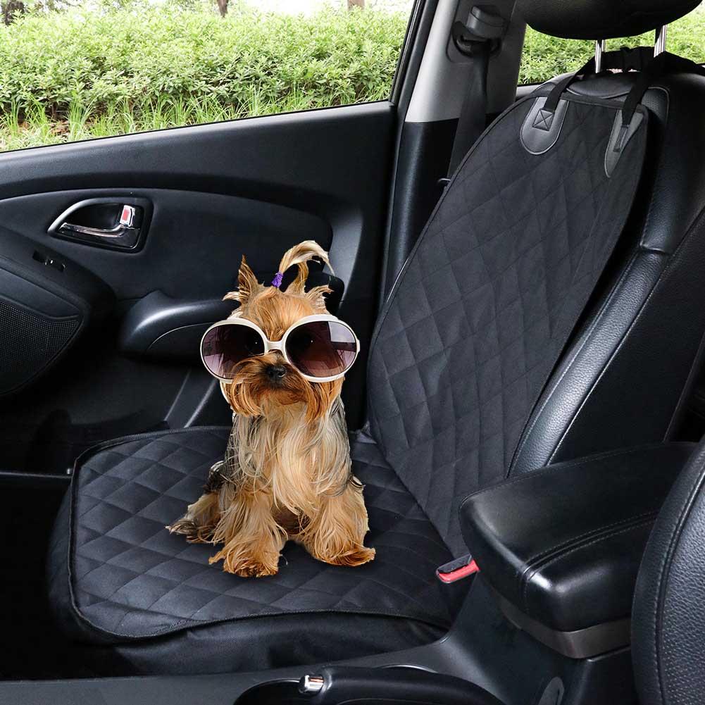 Black pet front seat cover fitted in a car with a small dog