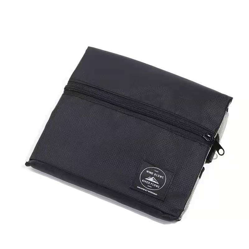 Black fold-flat travel overflow bag