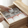 White sectioned drawer organiser box