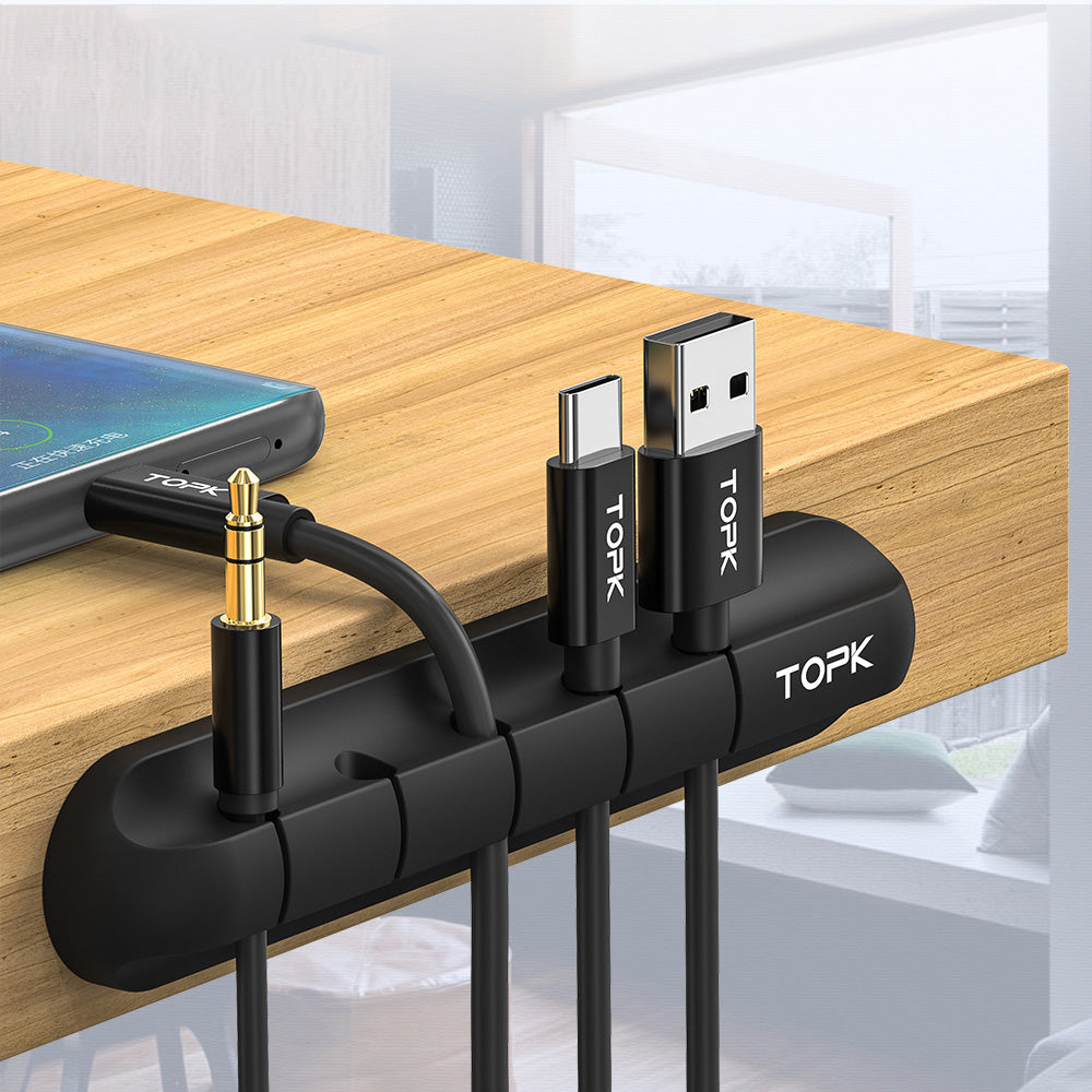 Six-pack silicone cable manager set arranged on a desk