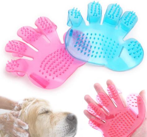 Pink and blue palm-fit pet bath grooming brushes with a dog