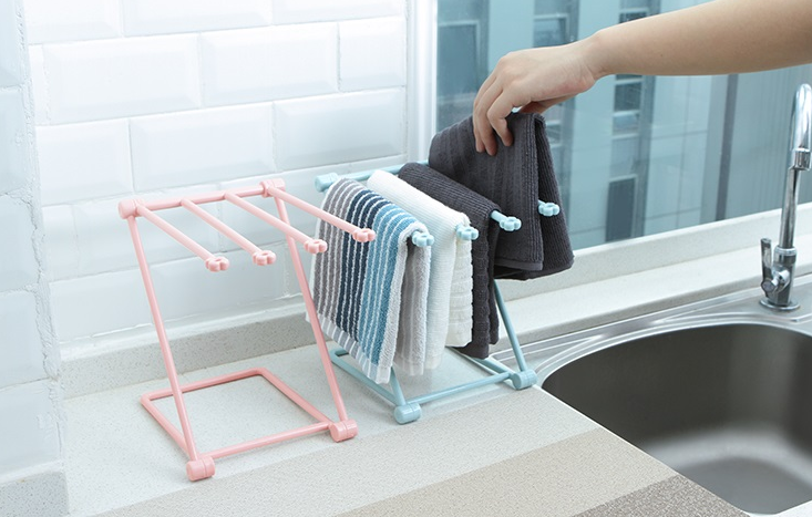 Dishcloth drying rack holding a kitchen cloth