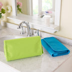 Hanging travel organiser shown open with storage pockets