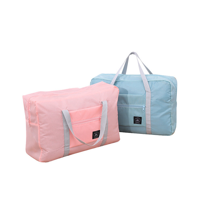 Foldable travel bag shape and carrying handles