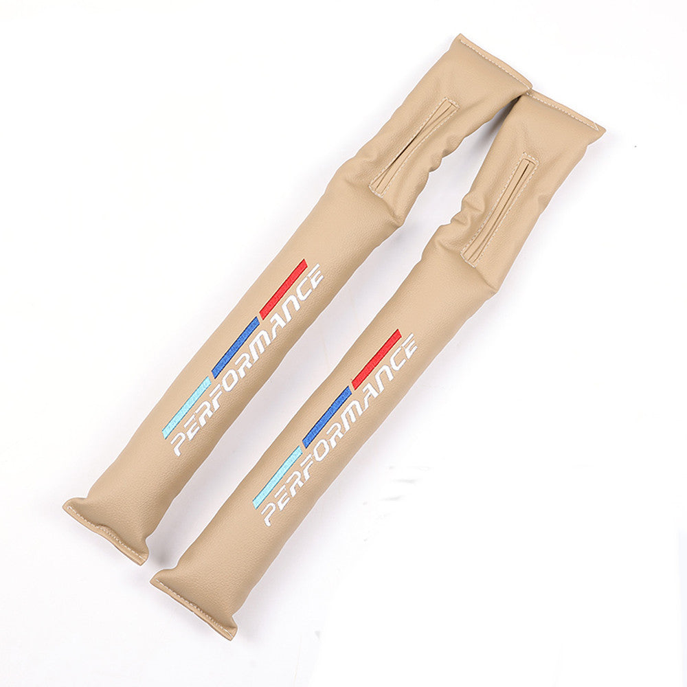 Beige car seat gap filler pair