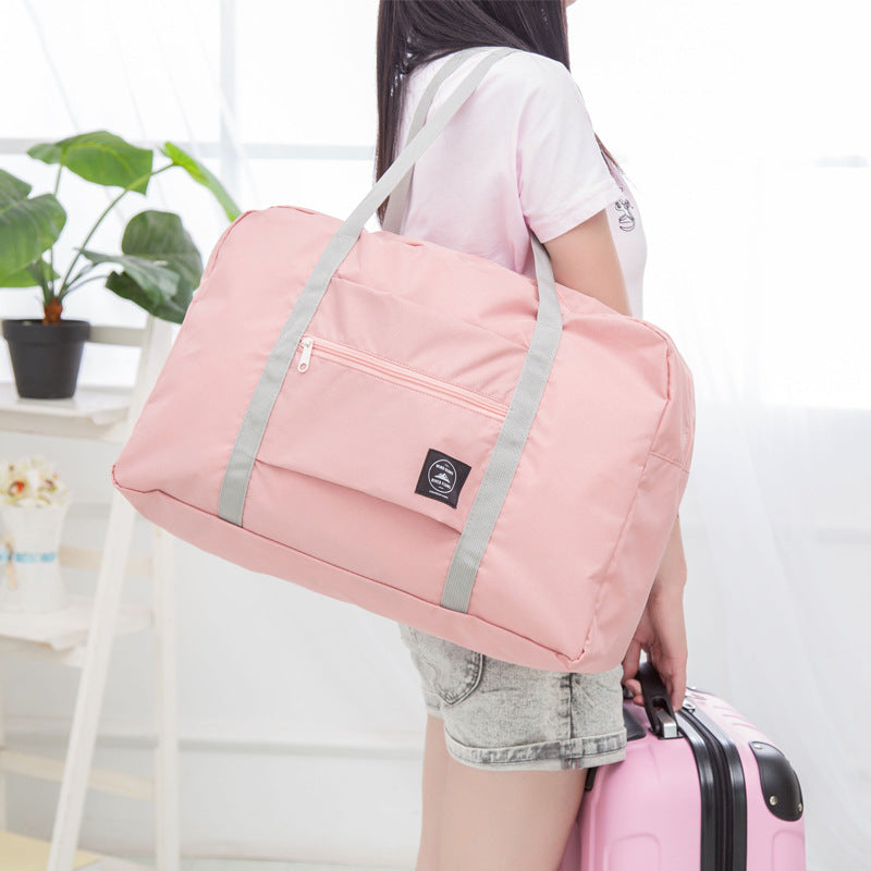 Fold-flat travel bag shown packed for a trip
