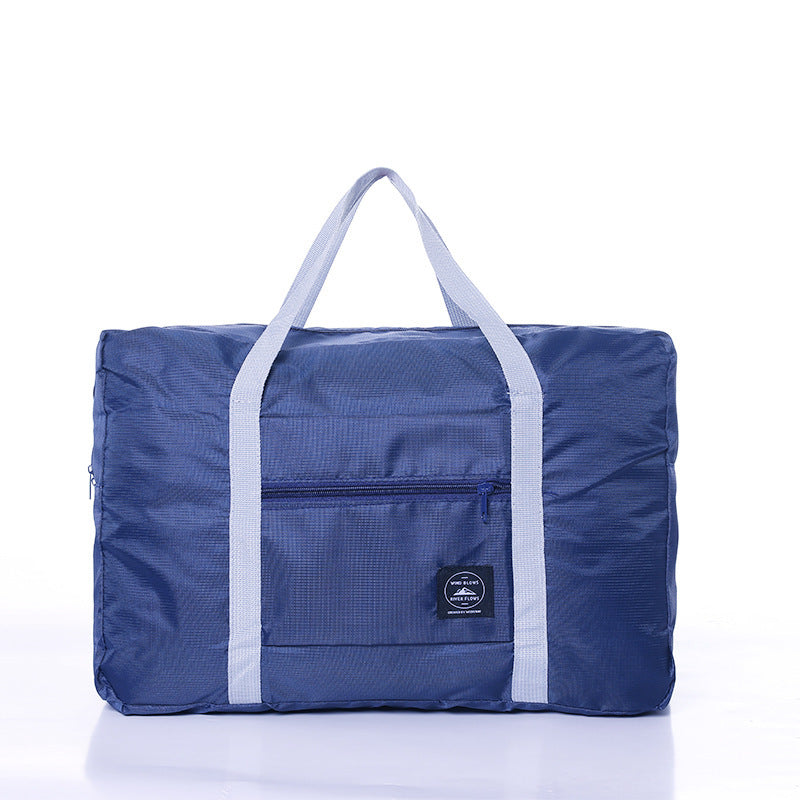 Navy blue fold-flat travel overflow bag