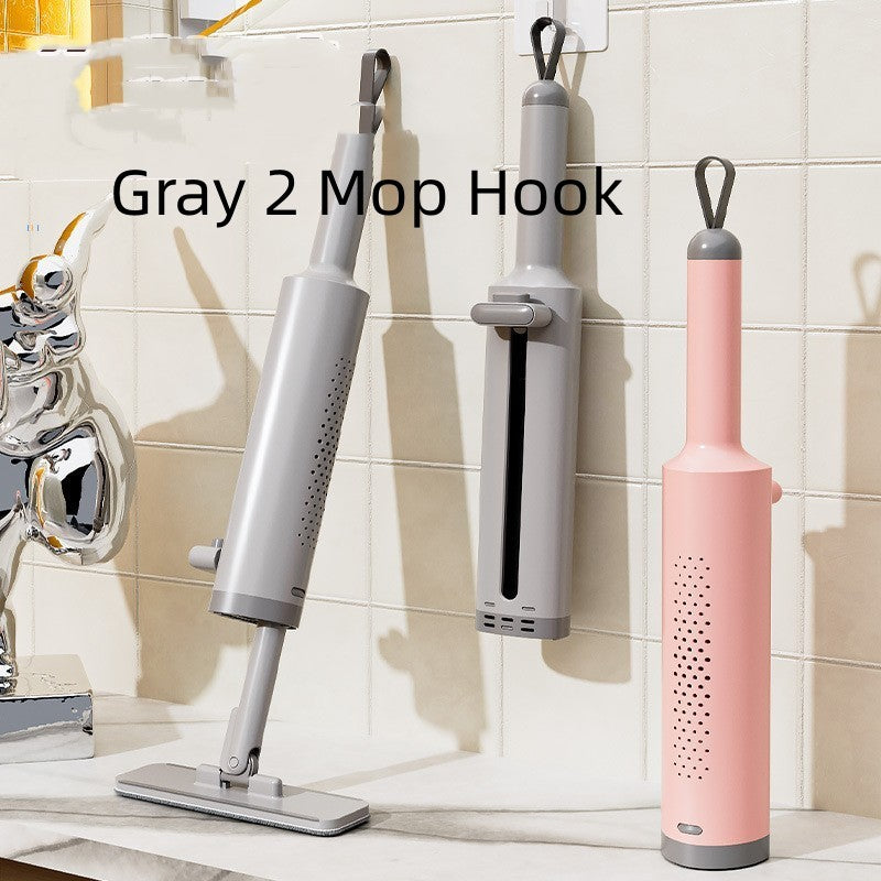 Grey self-squeeze mini mop with two reusable pads