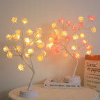 Touch-control LED rose tree lamp illuminated on a tabletop