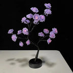 Black rose tree lamp with purple illuminated flowers