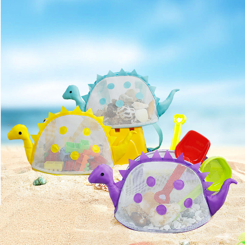 Dinosaur mesh bags on a beach with example toys; one bag in selected colour supplied