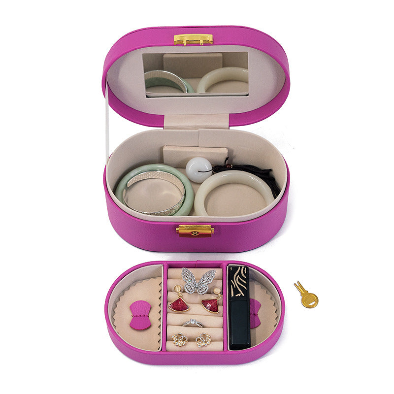 Purple oval jewellery case open with two storage levels