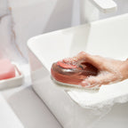 Soap-dispensing brush detail
