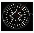 12-pack bicycle spoke reflective strips installed on a bicycle wheel