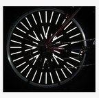 12-pack bicycle spoke reflective strips installed on a bicycle wheel