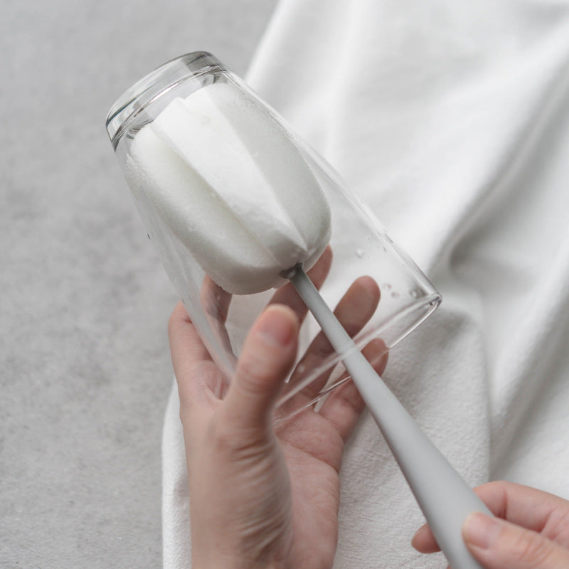 Cup brush standing upright between uses