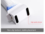 Red and white toothpaste tube squeezer pair